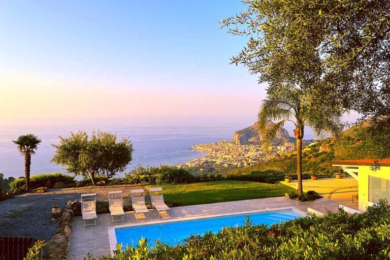 Luxury villa evening Cefalu Mediterranean sea view from the pool
